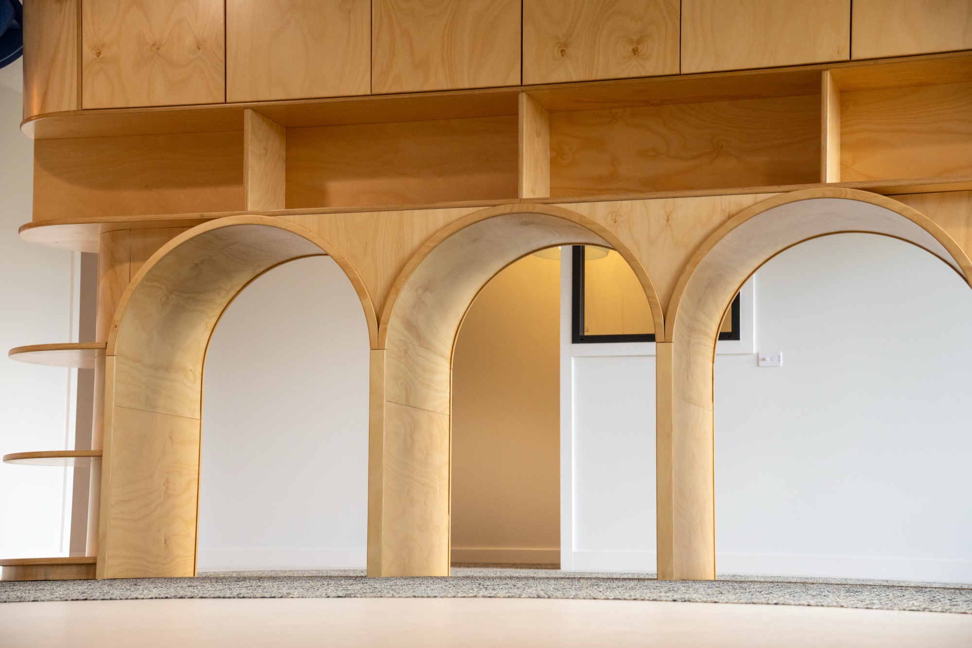 Timber arch with curtain detail