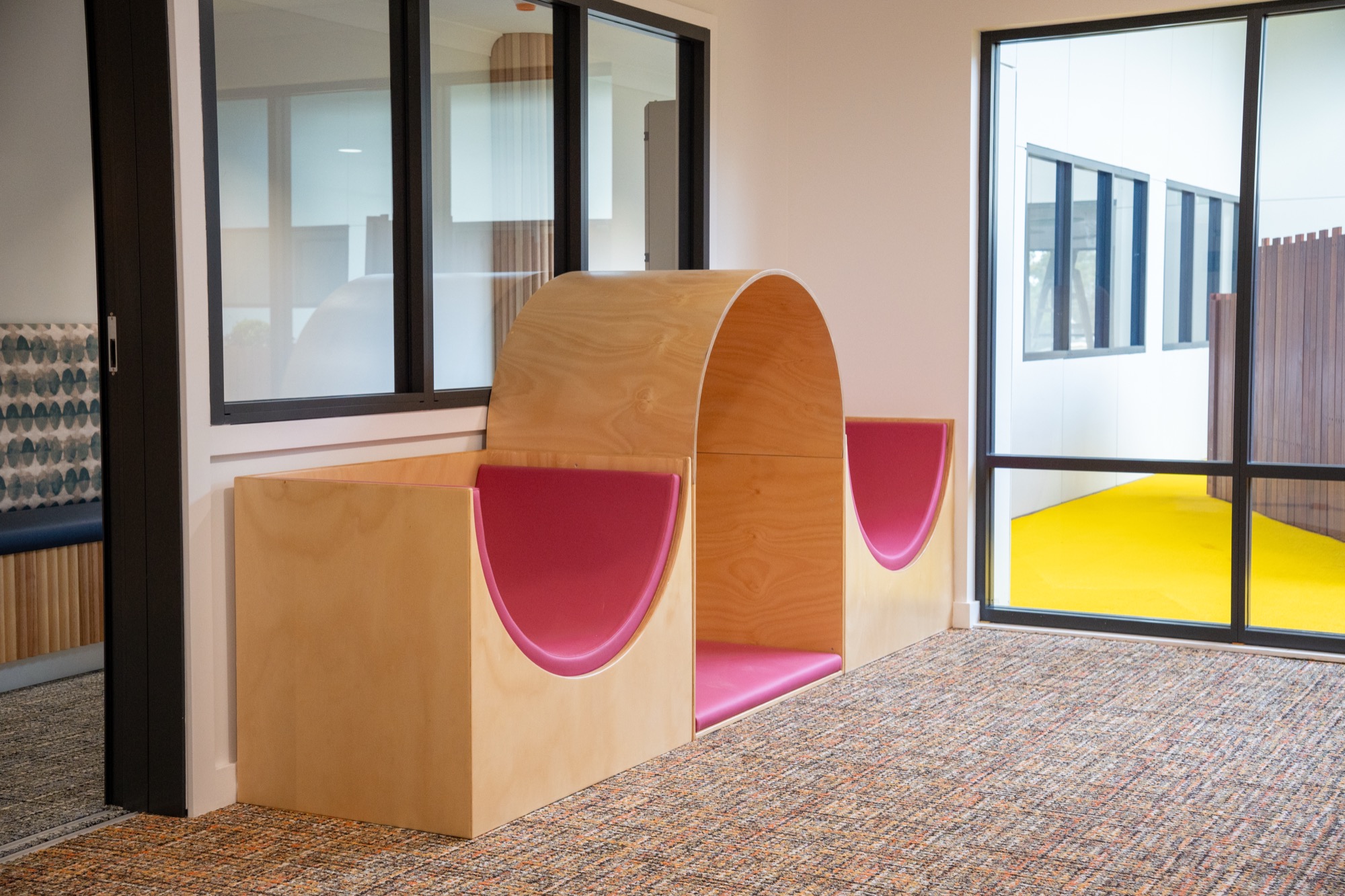 Custom indoor slide built into joinery